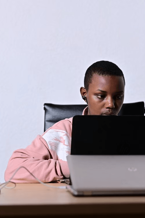 Student focused on a laptop screen